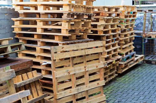 Workers placing a skip and securing load