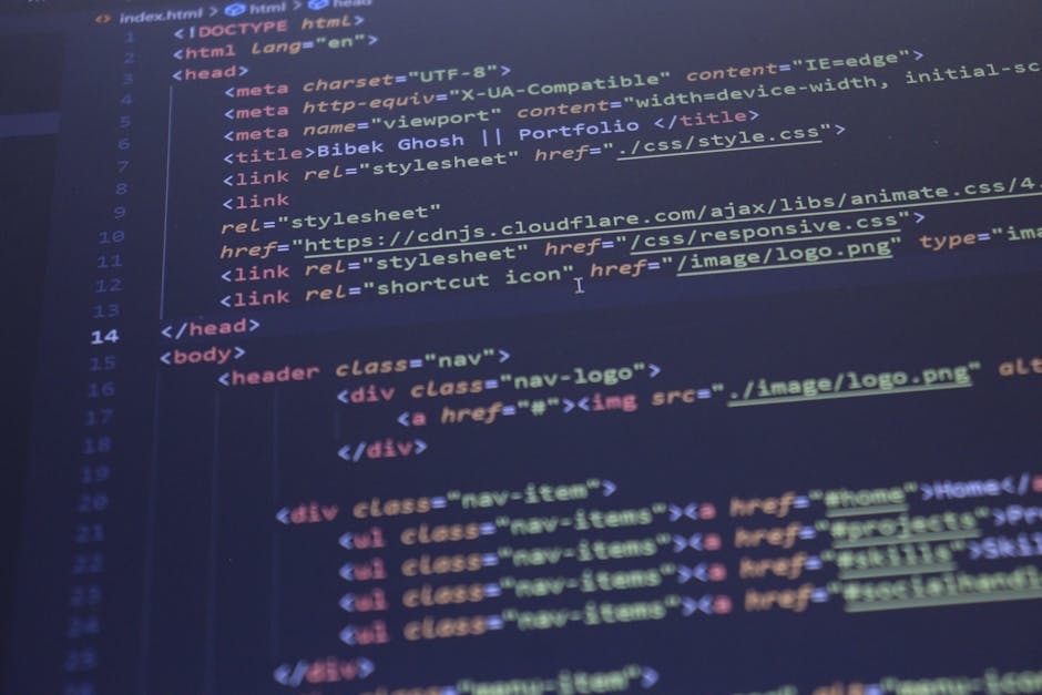 Close-up image of a computer screen displaying a code editor with an HTML document open. The code shows the structure of a webpage, including line tags for DOCTYPE, html, head, and body sections. Visi